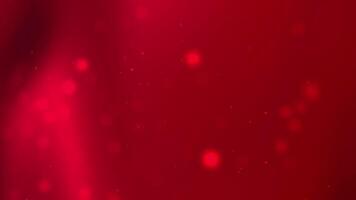 Red background with blurred dots of light. Ideal for festive designs, holiday promotions, and dynamic graphic projects with a vibrant look. video