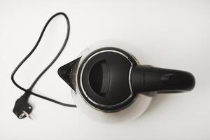 Electric kettle on a white background. A metal teapot photo
