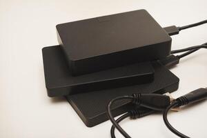 Hard drives Modern data storage devices with USB wires. photo