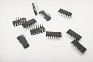 A microcontroller on a white background. electronic chip in a plastic case. photo