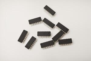 microcontroller on a white background. electronic chip in a plastic case. photo