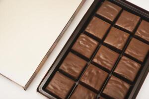 boxes chocolate bars are shown on a white surface photo