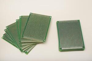 breadboard for electronics. The printed circuit board photo