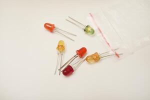Multi-colored LEDs. Old LEDs on a white background.Red LEDs. photo