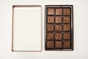 chocolate bars are shown on white surface photo