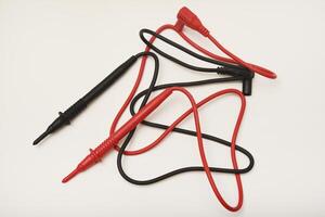 The red and black wires of the measuring device. Probes for multimeter. photo