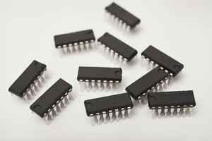 A microcontroller . An electronic chip in a plastic case. photo