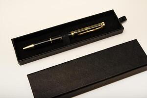 A gift pen in a box. black fountain pen. photo
