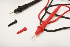 The red and black wires of the measuring device. photo