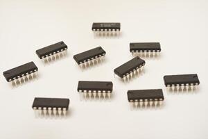 microcontroller on a white background. An electronic chip in a plastic case. photo