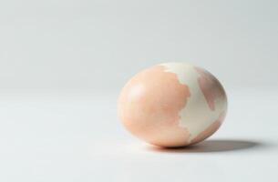 Cracked painted Easter egg, symbolic and artistic still life composition photo