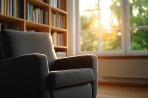 Cozy armchair by the window in a peaceful library setting with sunlight streaming in during the late afternoon photo