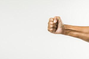 Fist raised in solidarity signifying strength and determination photo