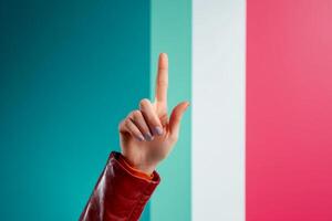 Hand gesture against colorful backdrop representing culture and identity photo