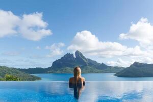 Relaxing in a serene infinity pool with stunning mountain views at a tropical paradise resort photo