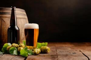 Craft beer with fresh hops and wooden barrel on rustic table in dim light photo