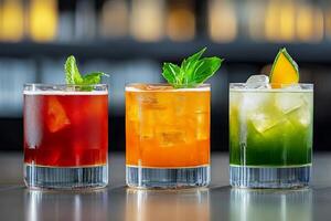 Colorful cocktails served in stylish glasses on a bar counter with a blurred background creating a lively atmosphere for social gatherings photo