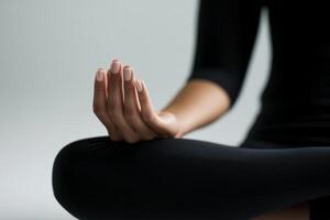 Mindful meditation practice in a serene environment with a focused hand gesture at sunset photo