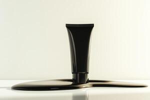 Black cosmetic tube resting on a smooth black liquid surface against a light background in a minimalist setting photo