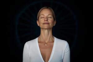 Mindfulness practice with a serene woman meditating indoors at dusk, focusing on inner peace and tranquility photo