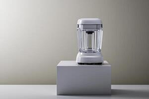 Modern kitchen blender displayed on a minimalist pedestal in a neutral-toned setting photo