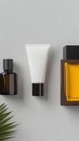 Elegant arrangement of fragrances and skincare products on a minimalist surface photo