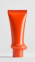 Bright orange tube stands out against a neutral background highlighting minimalist design and vibrant color photo