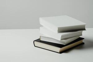 Stacked books on a clean white surface showcasing an inviting reading environment perfect for any study session or relaxation photo