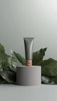 Luxurious skincare product displayed elegantly with green foliage on a neutral backdrop photo
