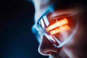 A person showcases futuristic glasses that reflect bright, colorful light patterns against a dark background, highlighting technological innovation at a tech gathering photo