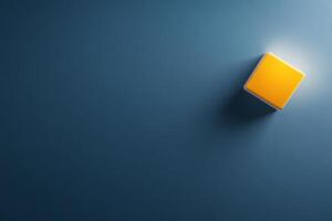 Bright yellow square light fixture casts a warm glow on a blue wall in a modern interior space photo