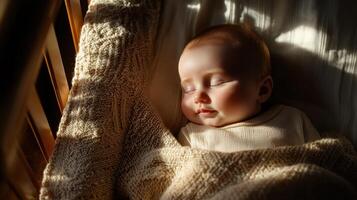 A baby sleeping in a crib with the sun shining on him photo
