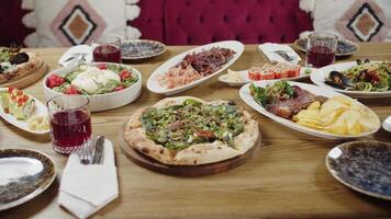 Festive Table with Assorted Dishes and Drinks video