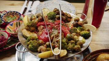 Plate of roasted vegetables and meat on a festive table video