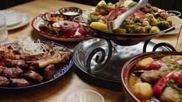 Grilled meat and vegetables on a festive table video
