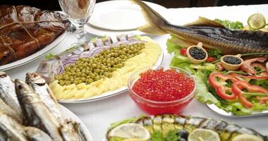 festive table with fish delicacies, sturgeon, caviar and shrimp video