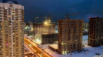 A view of the city at night with snow on the ground video