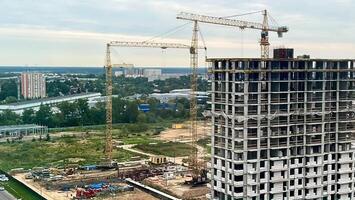 A large building under construction with cranes video