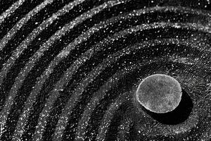 A black and white photo of a circle with a circle in the middle