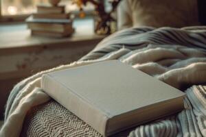 Minimalist Hardcover Book Mockup in Cozy Reading Nook with Soft Lighting and Elegant Design photo