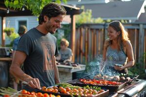Man and woman grilling vegetables and meat at a backyard barbecue party photo