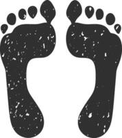 Two black human footprints with toes pointing forward are visible on a white background, creating a simple yet evocative image of human presence vector