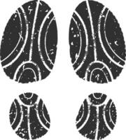 Four black shoe prints with grunge texture forming a walking pattern are isolated on a white background, creating a concept of movement and leaving traces vector