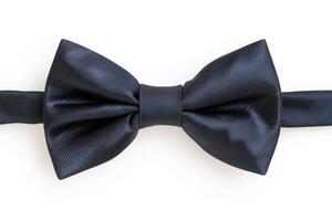Elegant black bow tie resting on a neutral background, showcasing a smooth texture and classic design, perfect for formal occasions and stylish attire in various settings photo