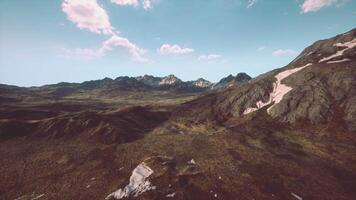 An aerial view of a mountain range in the mountains video