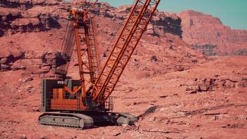 A large crane sitting in the middle of a desert video
