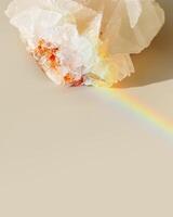 Luminous Quartz with Rainbow Flares. Sun's rays interact with quartz stone, iridescent rainbow glares, background with shining crystal at sunlight, aesthetic view with natural light effect photo