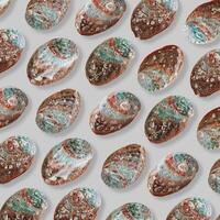 Repeated pattern of abalone seashells on neutral background. Natural Shells with of earthy brown, green, iridescent blue, with organic textures and pearlescent shimmer Top view summer Aesthetic view photo