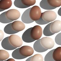 Natural eggs repeat pattern, beige brown colored Chicken egg with shadow at sunlight, mocha mousse trend color. Minimal Easter holiday concept, top view food still life photo, trend patterns photo