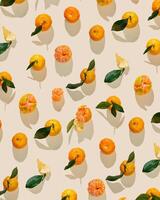 Set of Tangerines as minimal creative pattern, juice fresh orange yellow fruits with green leaves on beige background. Citrus mandarines, still life food, trend flat lay, summer aesthetic photo